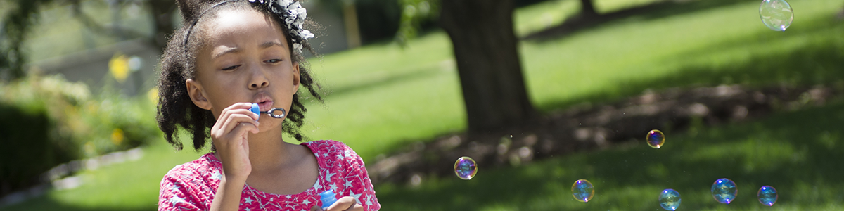 Girl blowing bubbles