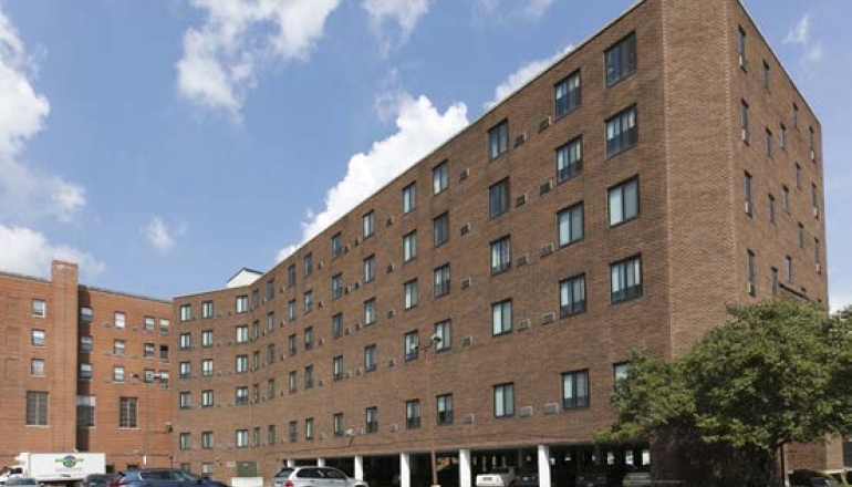 Brick building exterior and parking lot