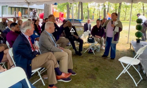 Resident Luz Ramos speaks at event